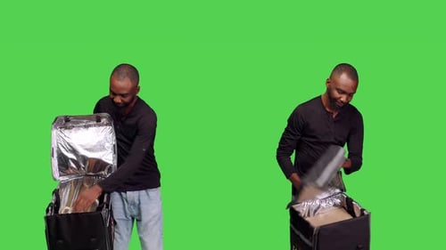 Confident Deliveryman with Thermal Bag Delivering Meal