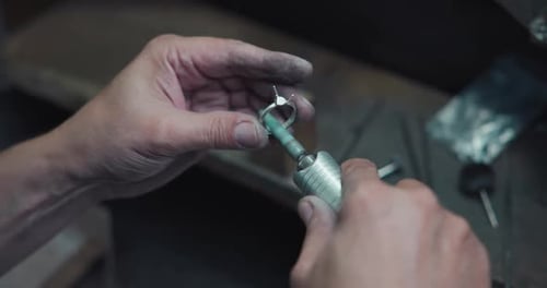 Jeweler Polishes a Ring During the Making Process in a Workshop