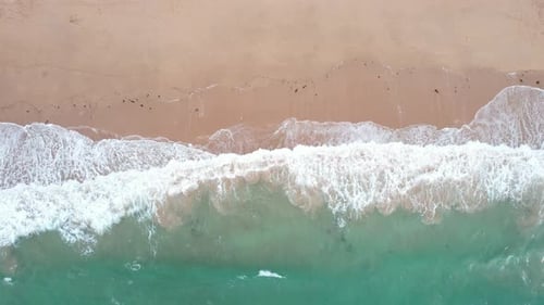 Aerial view of tranquil beach and turquoise water, France.