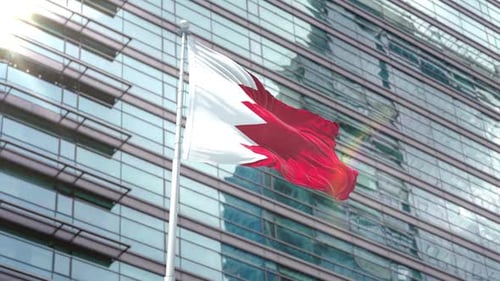 Realistic Bahrain Flag Waving in Front of Modern Corporate Building