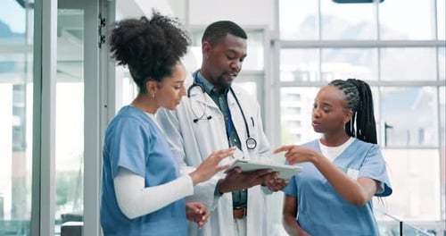 Doctors, nurses and tablet for hospital research, healthcare planning and advice