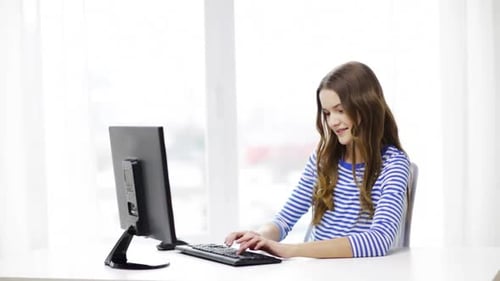 Teenage Girl Typing on Computer in Bright Room