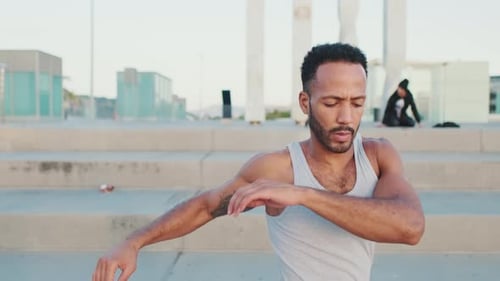 Man Shoulder Warm Up Exercise Outdoors