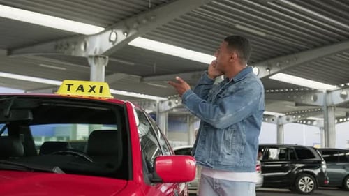 Male Taxi Driver Talking on the Smartphone Standing Near Car Slow Motion