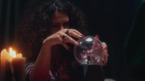 Fortune Teller Working with Crystal Ball, Talking to Her Client during Session