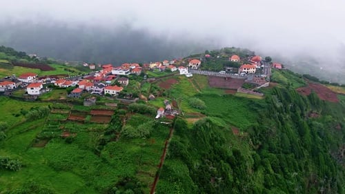 Lush Island Hills Landscape Drone Shot Greenery Mountain with Low Clouds Sky