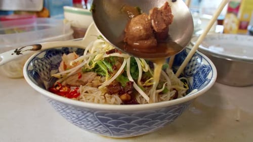 Noodle Dish with Broth Preparation Close Up