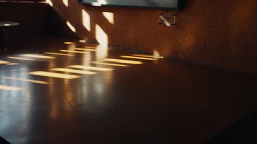 Sunlight Streaming through Window onto Polished Wooden Floor