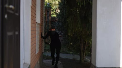 Intruder Approaching the Building A Tension Filled and Suspenseful Scene Unfolds