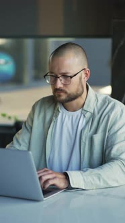 Smiling Businessman Working on Laptop Computer at Home Office Male Professional Typing on Laptop
