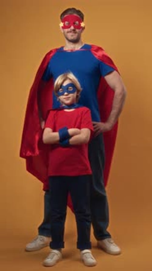 Father and Son Superhero Costumes in Studio
