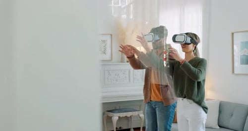 Couple Enjoying Virtual Reality Experience in Living Room
