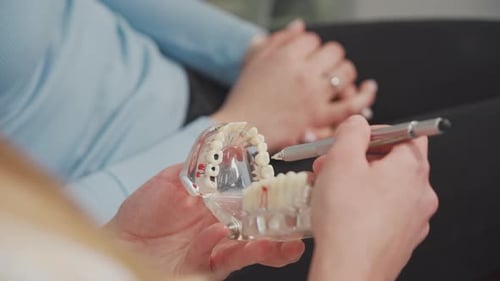 A dentist consults a patient in a dental clinic. Dentistry, stomatology.Close-up