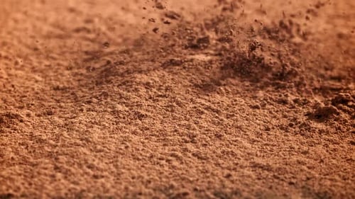 Cocoa Powder Falls on the Table Filmed on a Highspeed Camera at 1000 Fps