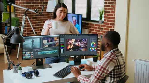 Creative Team Interracial Partners Collaborating on a Video Editing Project