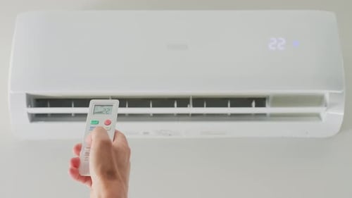 Adjusting Air Conditioner Temperature with Remote Control