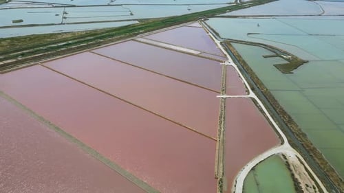 Aerial Drone View of the Salt Pans of Trapani, Sicily – Windmills and Golden Reflections