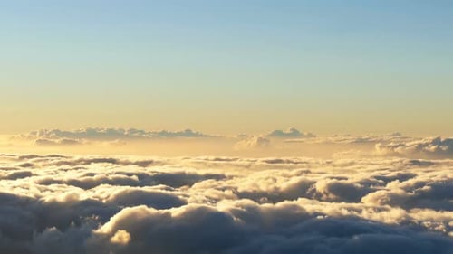 Aerial View of Golden Clouds During Sunset