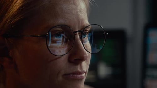 Woman Wearing Glasses Works at Computer Close Up