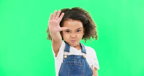 Angry child, stop and hand on green screen background with emoji and attitude
