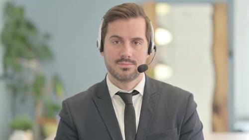 Man Wearing Headset and Suit in Office