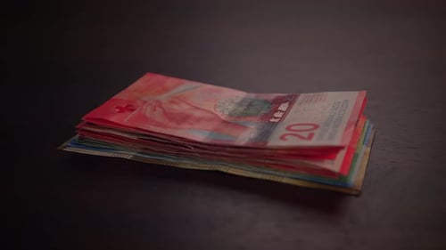 Stack of colorful Swiss Francs banknotes