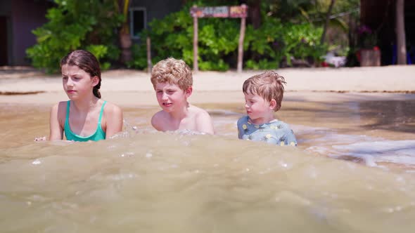 Children Getting Splashed By Waves On A Sunny Day, Nature Stock Footage ...