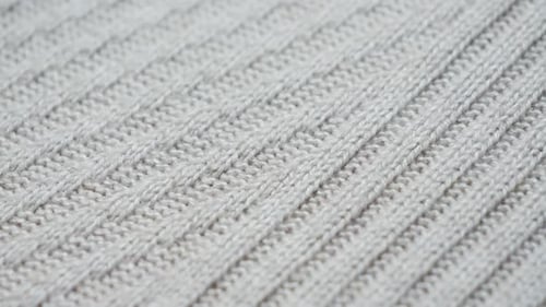 Extreme Close-Up of Knitted Wool Fabric Pattern