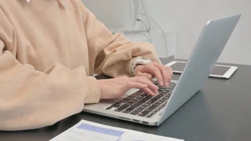 Close up of Female Hands Typing on Laptop