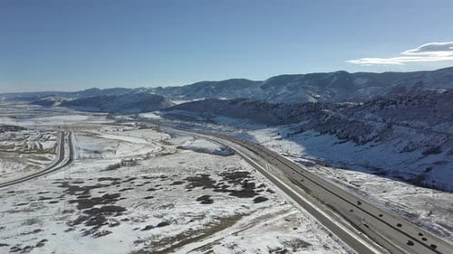 A pan over a Colorado Highway captures a picturesque winter scene