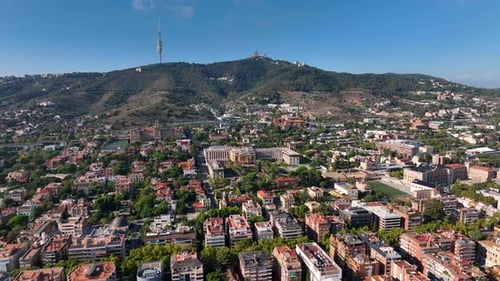 Aerial view of Barcelona skyline with Sagrat Cor temple during a sunny day, Catalonia, Spain