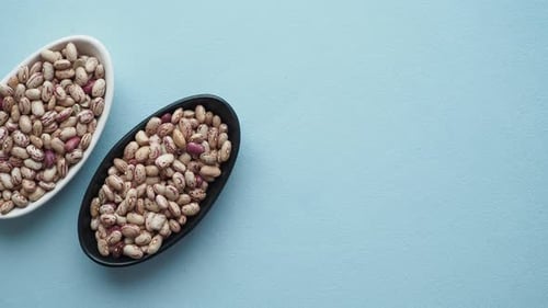 Pinto Beans Displayed in Black and White Bowls
