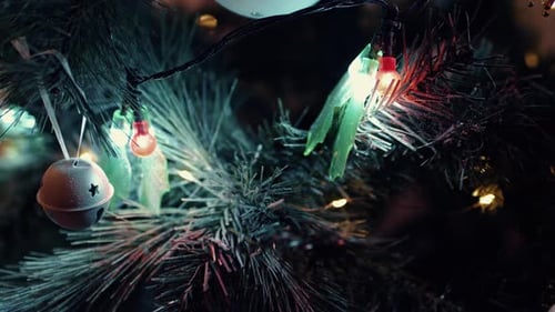Christmas Tree With Decorated With Christmas Lights And Ornaments At Night. - close up