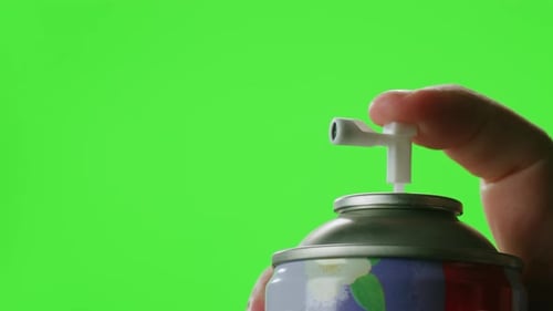 Man Applying Air Freshener Deodorant Spray for Bathroom Chroma Key Green Screen Closeup