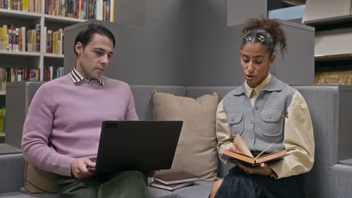 Young Diverse Students Working on Project Together in Modern Library