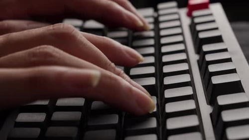 Fingers Typing On Grey Mechanical Keyboard Of Computer, Close Up Aside Shot