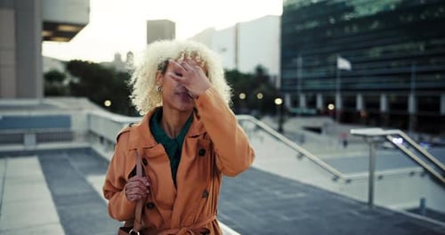 Stress, tired and business woman in city with headache, bankruptcy or depression for unemployment