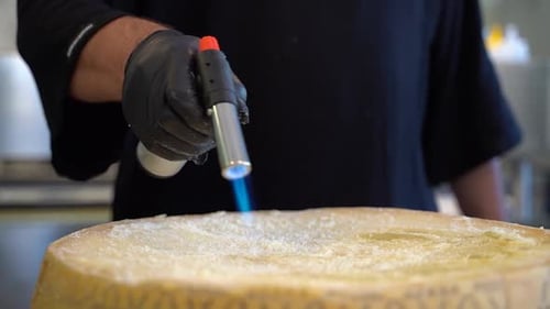 Chef Melts Cheese Wheel with Butane Torch