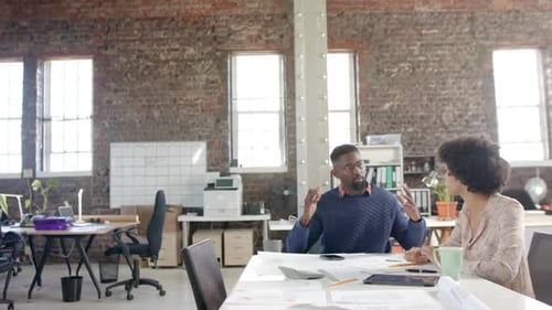 Business People Discussing Project in Office Setting
