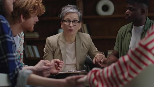 Multicultural Group in Therapy Circle with Senior Therapist Leading