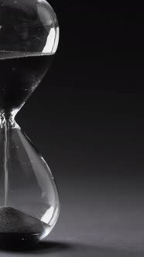 Close Up of Black Sand in Hourglass