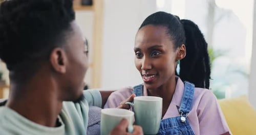 Charming Couple Enjoying Coffee and Conversation at Home