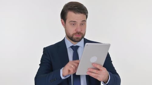 Man in Suit Using Digital Tablet