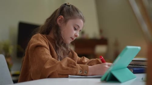 Side View Absorbed Schoolgirl Doing Homework Drawing and Looking Away Thinking