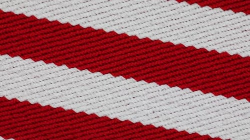 Knitted Textile With Red And White Horizontal Patterns. - Closeup Shot