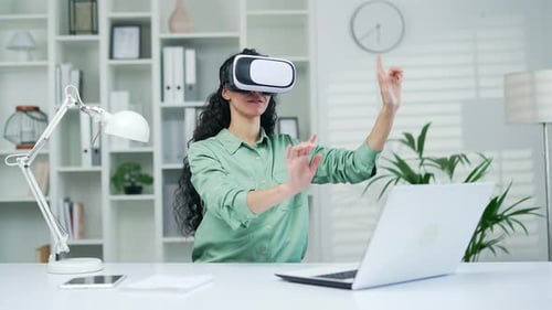 Woman Using VR Headset in Bright Office