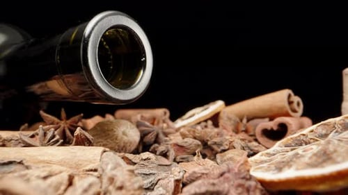 Spices for mulled wine. Empty bottle of wine, cinnamon and star anise. Dolly slider extreme close-up