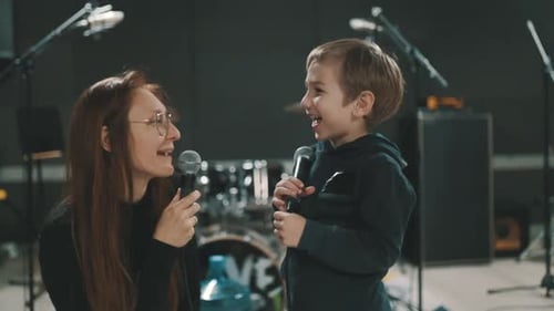 Mother and Son Singing Karaoke Together in a Music Studio