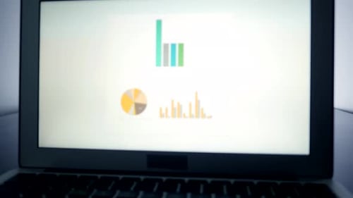 Laptop Displaying Business Graphs and Charts