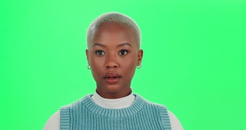 Black woman, face and surprise with green screen in studio for gossip or news